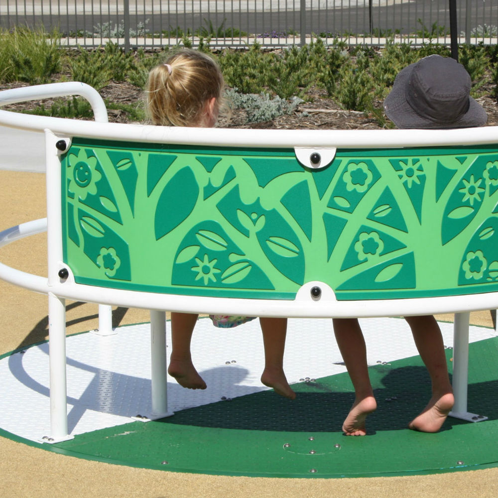 Close up shot of a Wildlife Whirl from Inclusive Play (an inclusive roundabout) detailing the tree design