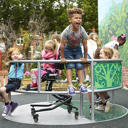 Diverse group of children playing on a Wildlife Whirl from Inclusive Play: an inclusive roundabout